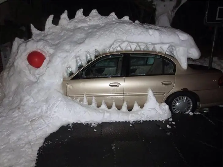 Snowy Dinosaur Devours Car